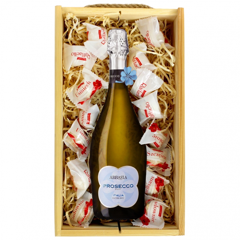 Białe wino musujące Prosecco Abbazia z pralinami Raffaello
